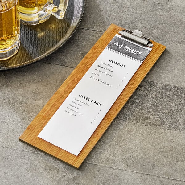 A Choice natural wood menu holder with a menu on a wood board.