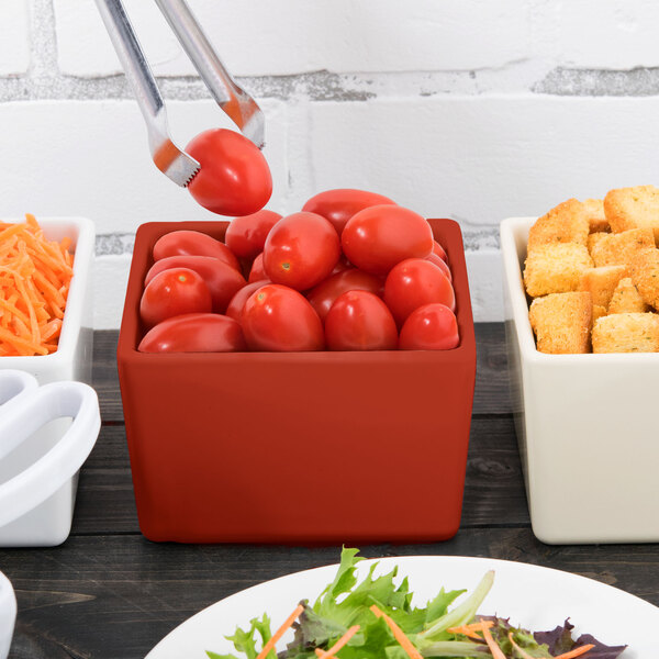 A Tablecraft copper bowl with tomatoes and croutons.