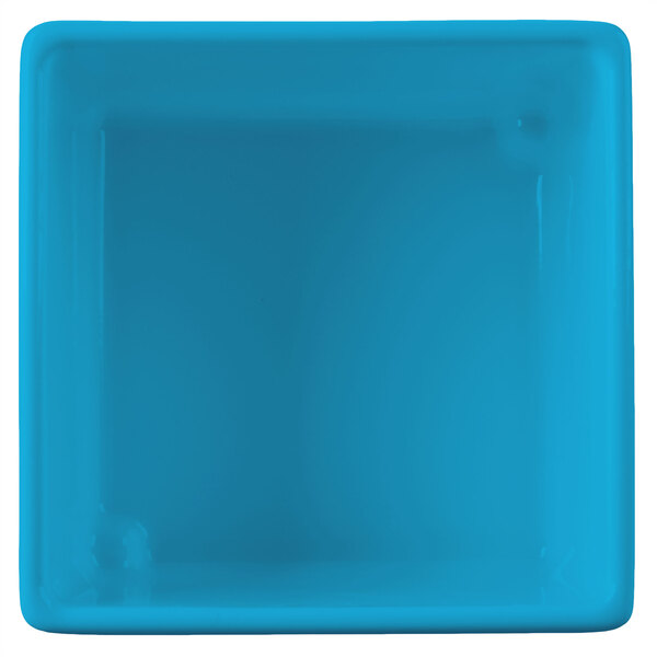 A sky blue square plastic bowl with a white interior and straight sides.