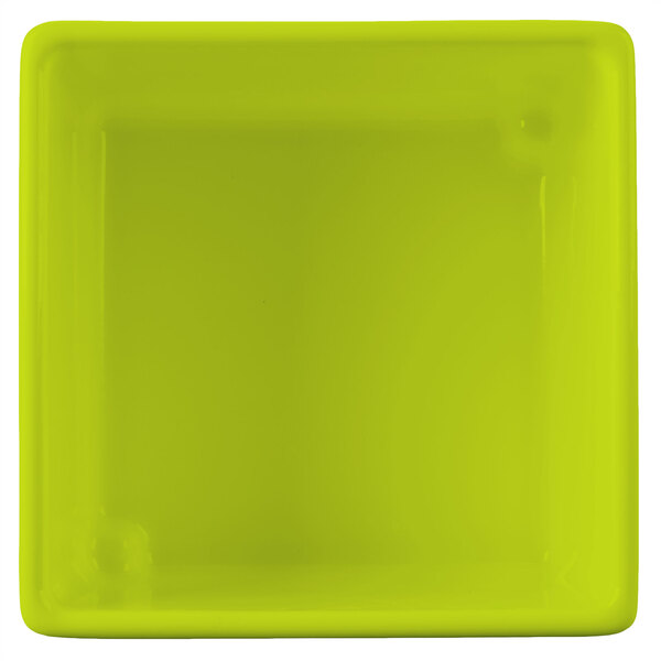 A lime green square plastic bowl with a lid.