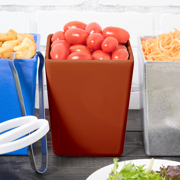 A Tablecraft brown straight sided bowl filled with tomatoes on a salad bar table.