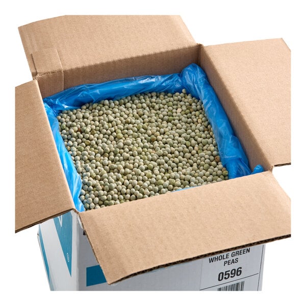 A cardboard box containing dried whole green peas lined with a blue plastic bag.