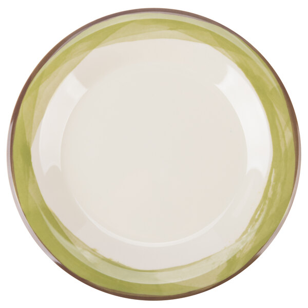 A white melamine plate with a wide rim and a green edge.