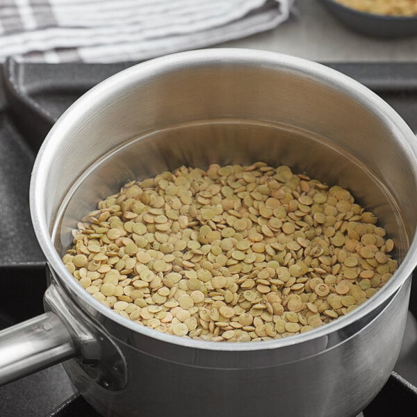 Brown Lentils in a cooking pot with water