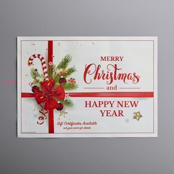 A white and red Holiday Ornaments gift certificate placemat with red ribbon and a bow.