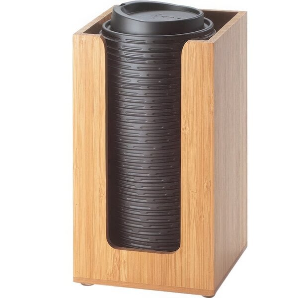 A Cal-Mil bamboo countertop cup and lid organizer with black plastic cups and lids.