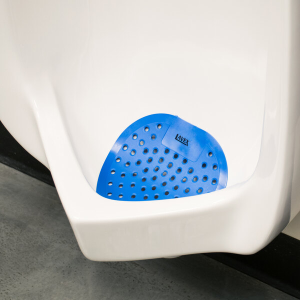 A urinal with a Lavex Floral Scent Deodorized urinal screen featuring a blue circle.
