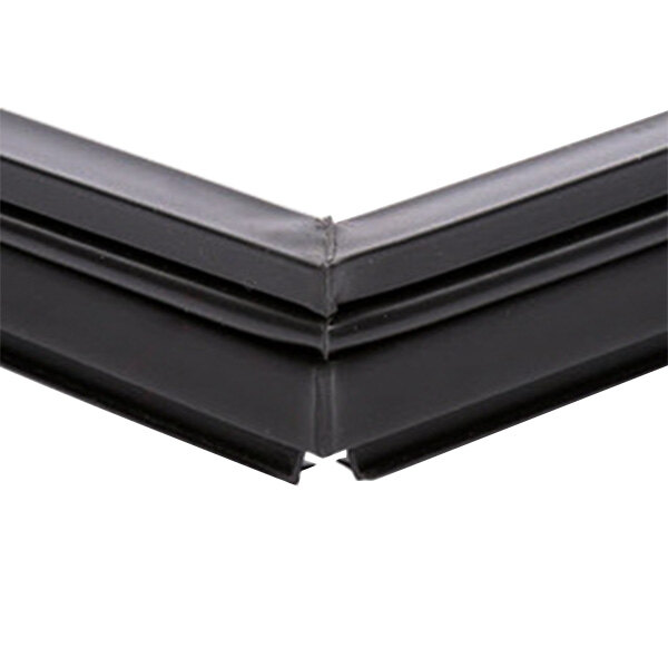 A close up of a black corner on a True 810883 equivalent magnetic door gasket.