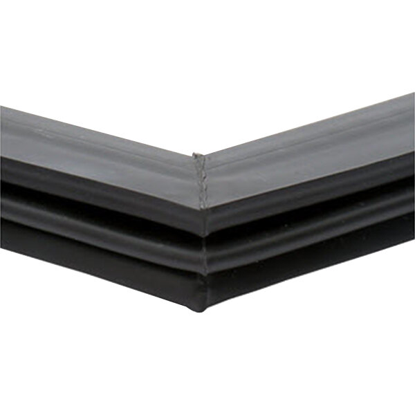 A close-up of a black True magnetic door gasket corner.