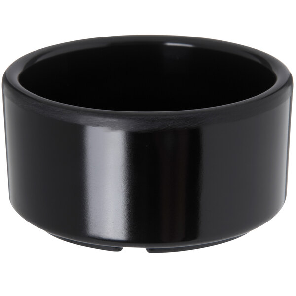 A Carlisle black melamine ramekin.
