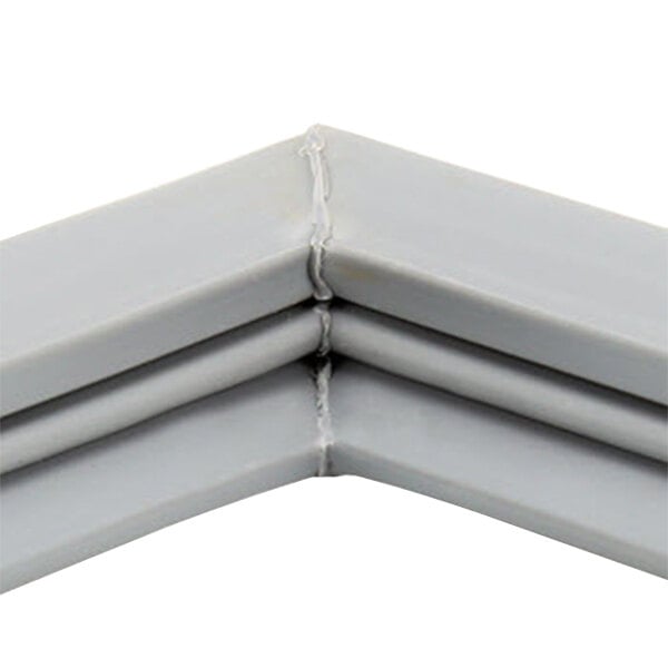 A close up of a gray corner of a metal Beverage-Air door gasket.