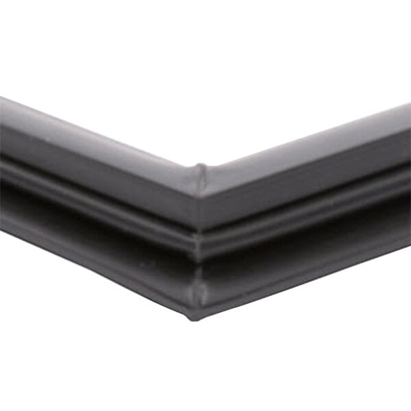 A close up of a black plastic corner on a white background.