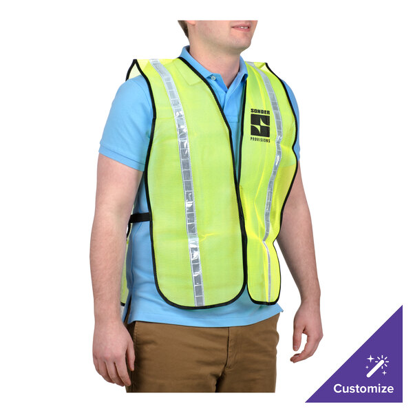 A man wearing a lime high visibility mesh safety vest.