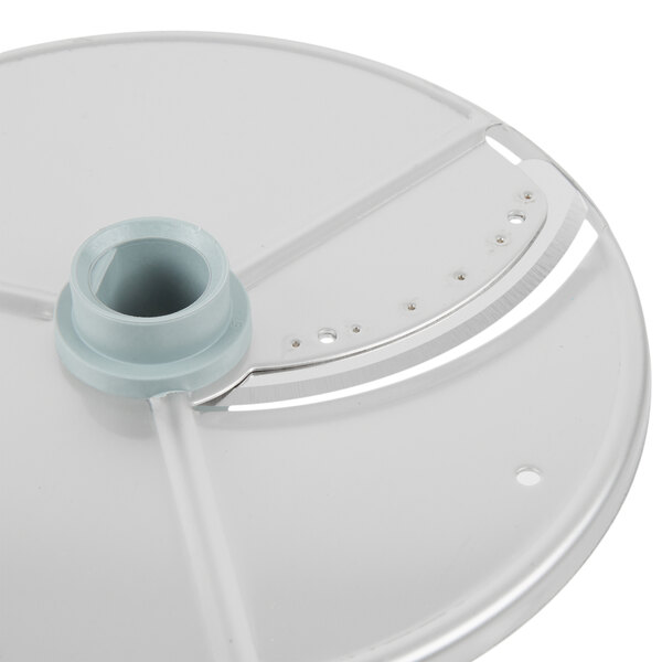 A circular white Robot Coupe food processor disc with a hole.