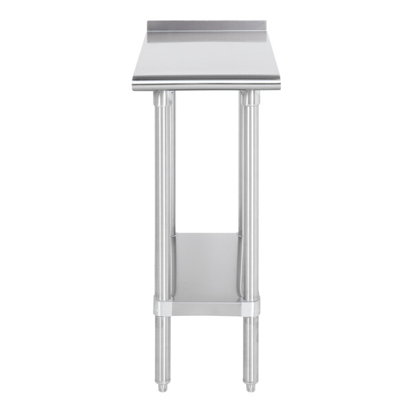 A stainless steel filler table with a backsplash and an undershelf.