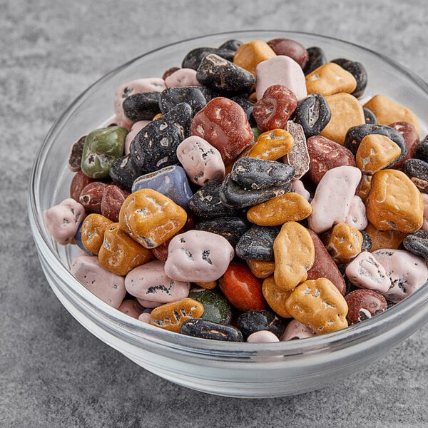 A bowl of Chocolate Rocks topping on a table.