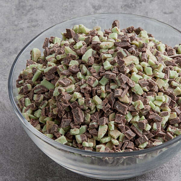 A bowl of Andes Mint Topping on a table.