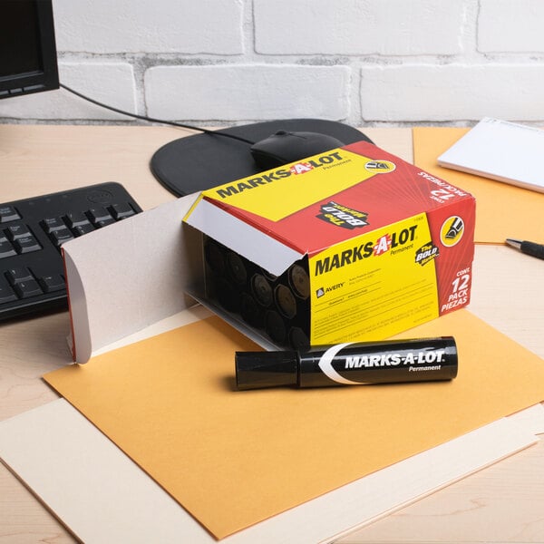 A box of Avery Marks-A-Lot Jumbo Black Chisel Tip Permanent Markers on a desk.