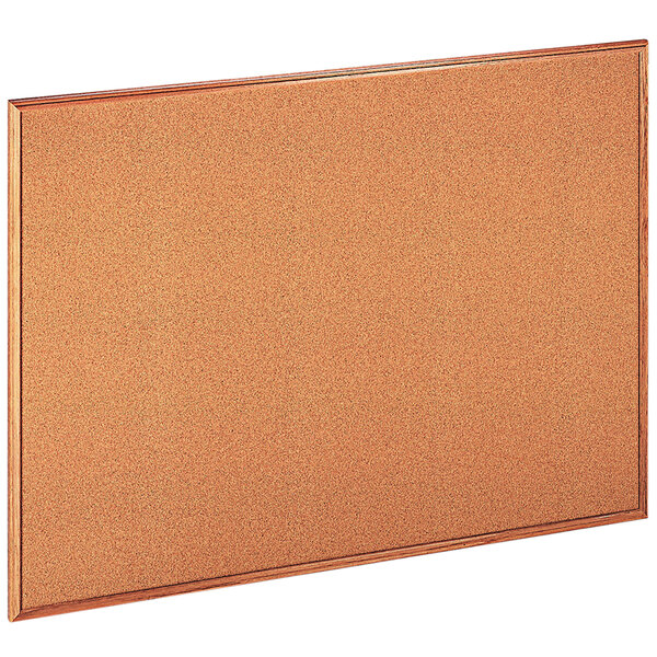 A Universal cork board with an oak frame.