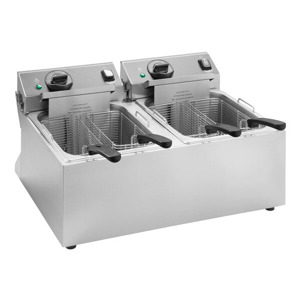 A Vollrath commercial countertop deep fryer with two baskets.