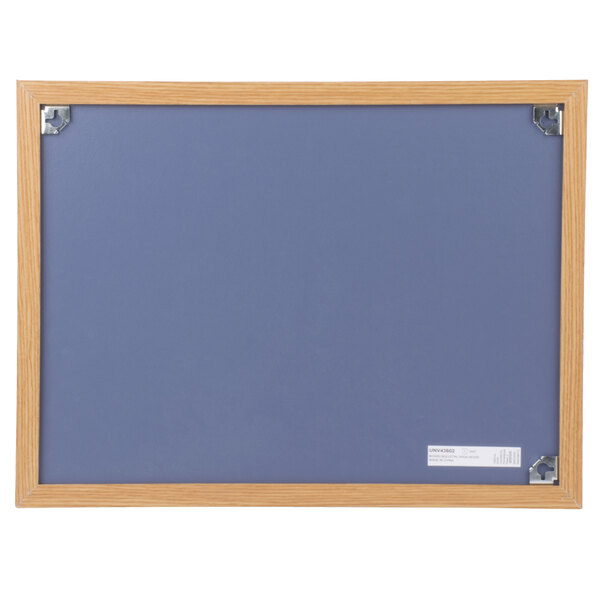 A blue Universal cork board with an oak frame.