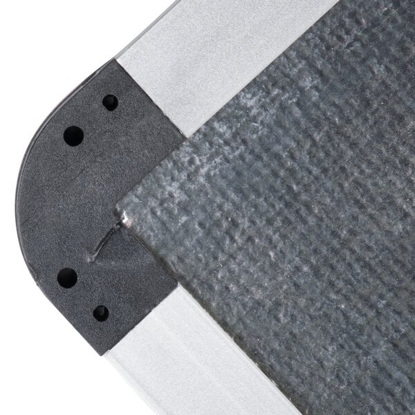 A close-up of a Universal white magnetic steel dry erase board.