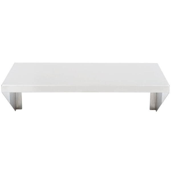 A white rectangular shelf with metal legs.