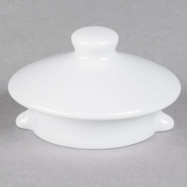 A TuxTrendz Bright White china teapot lid with a small knob on top.