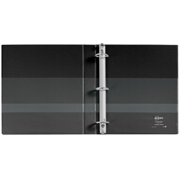 A black binder with silver metal tabs.