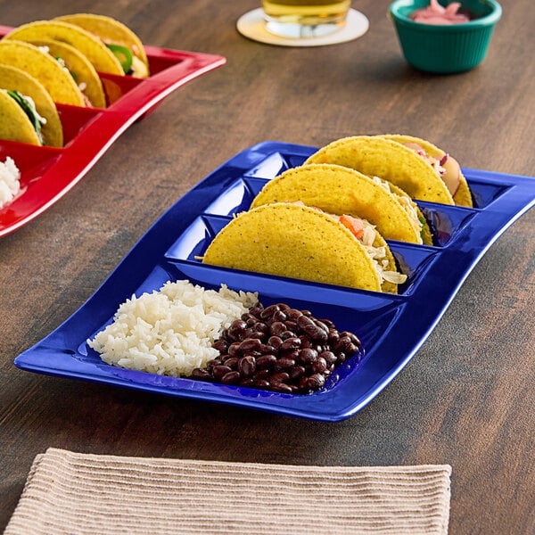 A TuxTrendz cobalt china plate with tacos and rice.