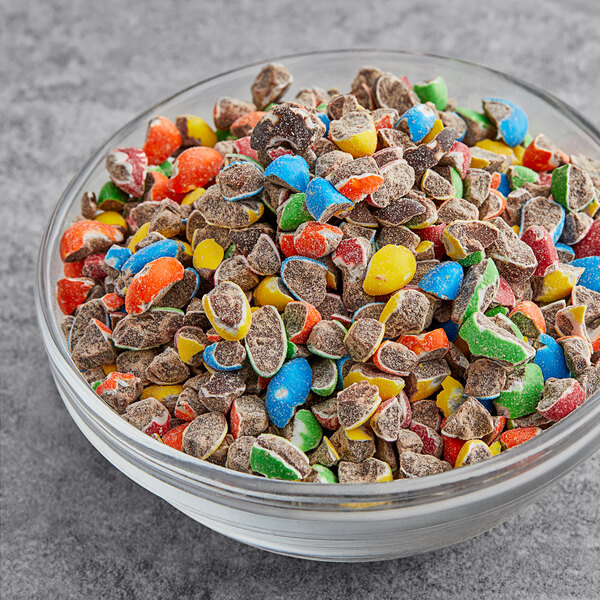 A bowl of Chopped M&M'S on a table.