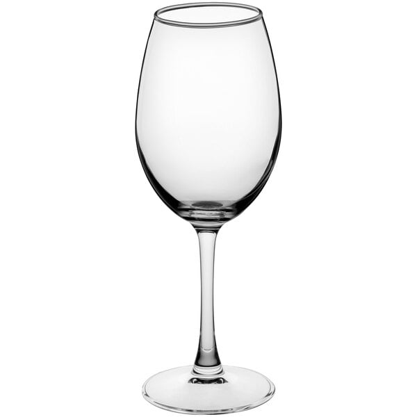 A close-up of a clear Acopa Select Blanc wine glass with a stem.