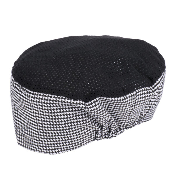 A black and white houndstooth mesh baker's skull cap.