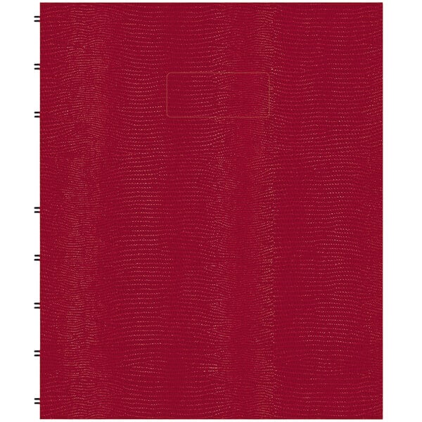 A red Blueline MiracleBind notebook with a red cover.