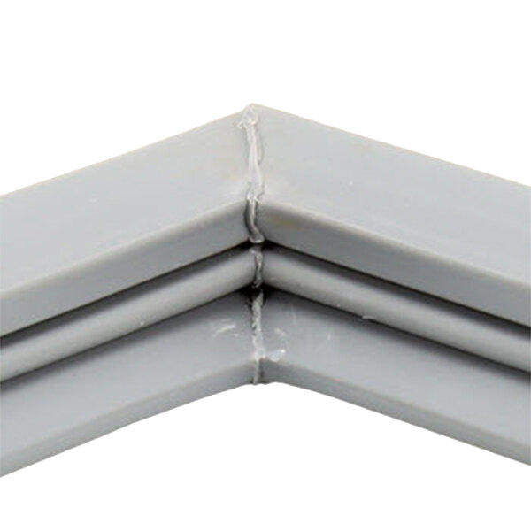 A close-up of a gray corner piece of a Delfield 1702262 equivalent door gasket.