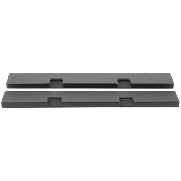 Two black plastic Hoshizaki HS-2036 rectangular pieces on a table.