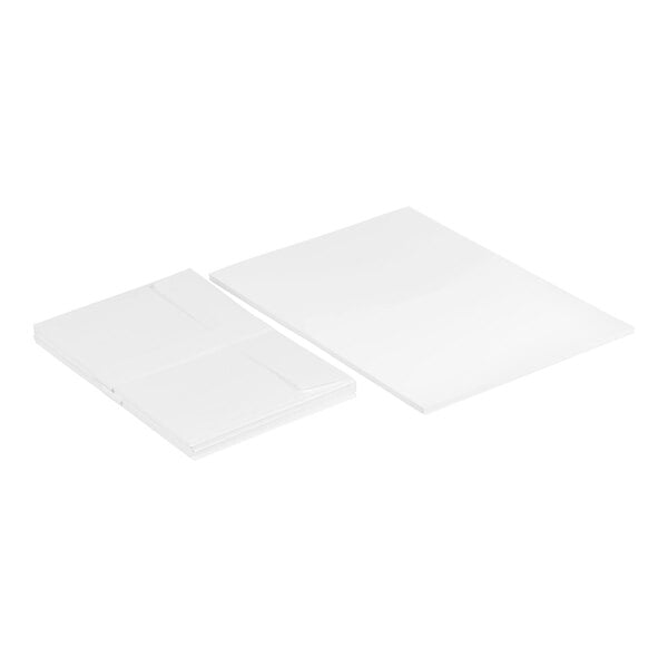 Two stacks of plain white rectangular cards and matching envelopes are displayed on a white background.