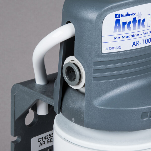 A close-up of a Manitowoc Arctic Pure water filtration system cartridge.