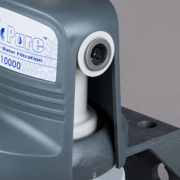 A grey plastic Manitowoc water filtration container with a white cap and tube.