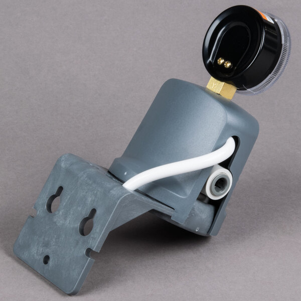 A grey Manitowoc Arctic Pure water filtration system with a black cap.