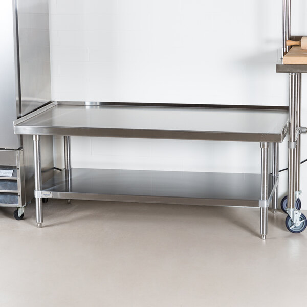 A stainless steel Advance Tabco equipment stand with a stainless steel undershelf.