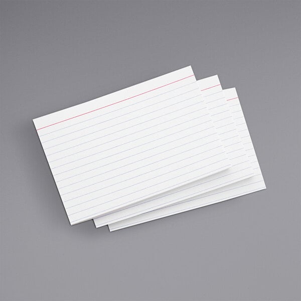 A stack of Universal white ruled index cards.