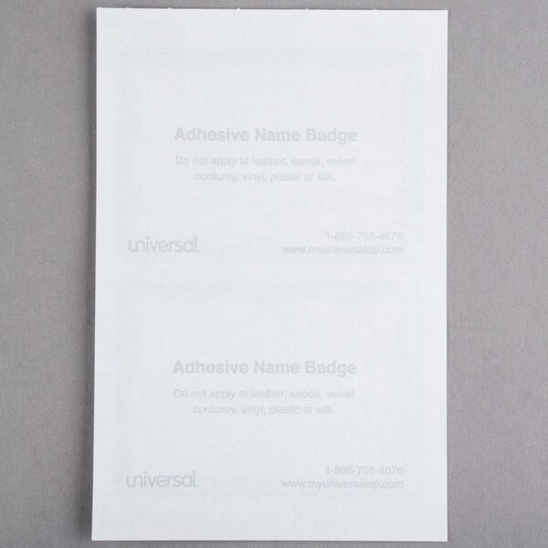 Two white Universal name badges with blue border and white paper inserts.