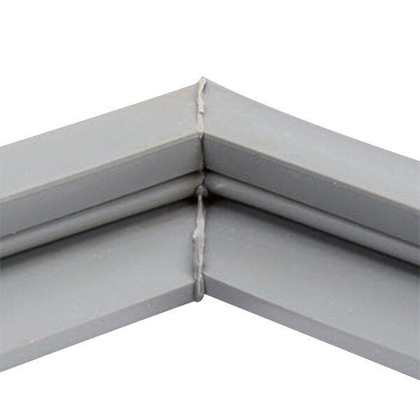 A close-up of a gray corner of a Delfield equivalent door gasket.