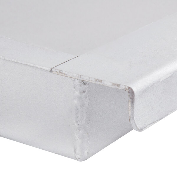 An Avantco grease tray in a white box with a lid.