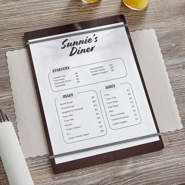 A dark wood Choice menu holder on a table with a menu in it.