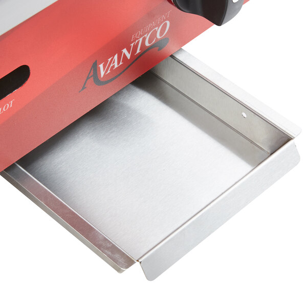 An Avantco grease tray in a drawer under a griddle.