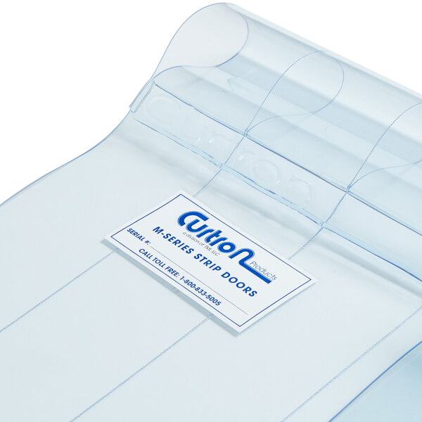 A clear plastic bag with a label for a Curtron Polar Reinforced Strip Door.