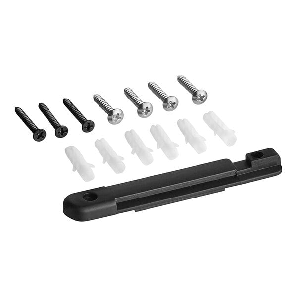 A black Lancaster Table & Seating wall-mount stanchion with a black retractable belt attached to a table.