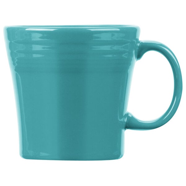 A close up of a teal Fiesta china mug with a handle.